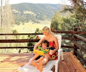 woman in yellow tank top sitting on brown wooden bench